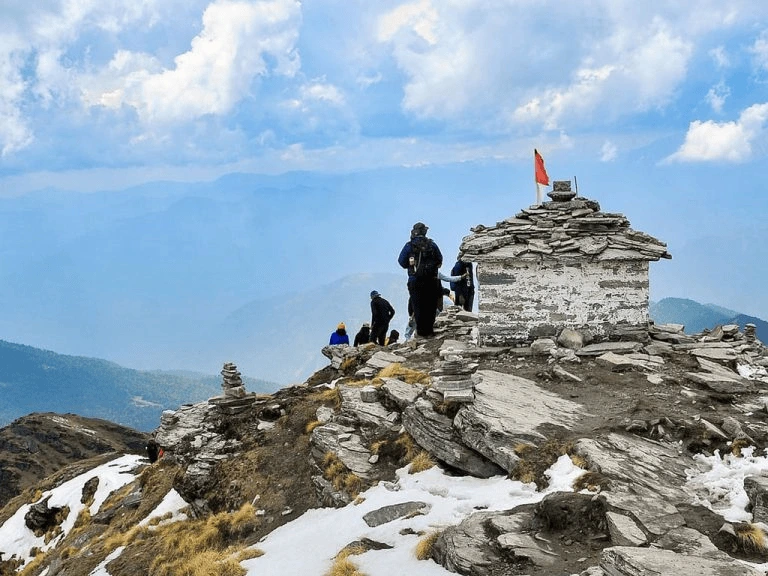 Top 12 Beautiful Hill Stations & Spiritual Destinations in Uttarakhand chopta having group of people on a mountain top